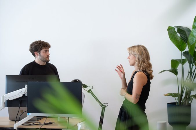 Two Picnic colleagues talking in the office