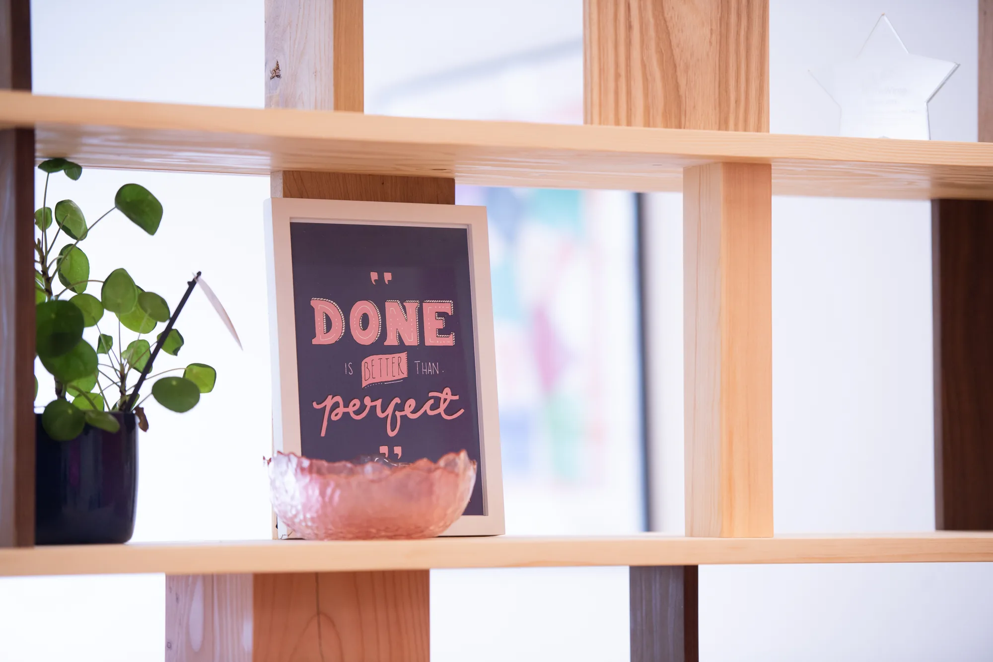A framed 'Done is better than perfect' print in the Picnic office