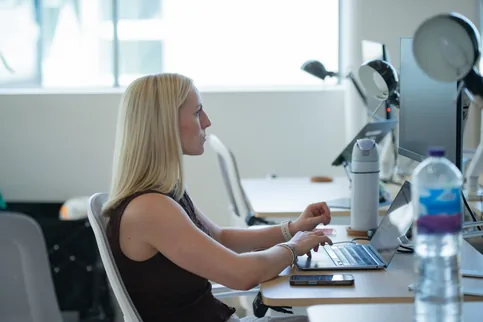 A Picnic team member working at her desk in the London office